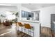 Kitchen and bar, features new bar stools and flooring at 8753 Champions Dr, Indianapolis, IN 46256