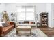 Sun-filled living room with elegant furnishings, hardwood floors, and stylish accents at 8753 Champions Dr, Indianapolis, IN 46256