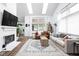 Bright and airy living room featuring vaulted ceilings, fireplace and stylish furnishings at 8753 Champions Dr, Indianapolis, IN 46256