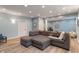 Finished basement with recessed lights, a gray sectional sofa, and a light wood floor at 8904 Carnation Dr, Noblesville, IN 46060