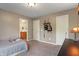 Bedroom with carpet, neutral walls, open doorways, and an attached bathroom at 8904 Carnation Dr, Noblesville, IN 46060