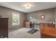 Bedroom featuring a treadmill, carpeted floors, neutral paint, and lots of natural light at 8904 Carnation Dr, Noblesville, IN 46060