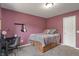 A bedroom space with carpeted floors, and a desk, creating a cozy atmosphere at 8904 Carnation Dr, Noblesville, IN 46060