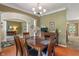 Inviting dining room with hardwood floors and a view through an archway into another living space at 8904 Carnation Dr, Noblesville, IN 46060
