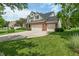 Beautiful two-story home with a well-maintained lawn, brick facade, and attached three-car garage at 8904 Carnation Dr, Noblesville, IN 46060