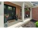 Inviting front porch with brickwork, flowers, and a cozy seating area perfect for relaxing at 8904 Carnation Dr, Noblesville, IN 46060