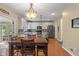 Eat-in kitchen featuring stainless appliances, granite countertops, a center island, and pendant lighting at 8904 Carnation Dr, Noblesville, IN 46060