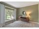 Cozy living room with carpeted floors, a large window seat, and neutral decor for a serene atmosphere at 8904 Carnation Dr, Noblesville, IN 46060