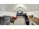 This carpeted attic features a bed, printer, and lots of storage space at 9653 Cypress Way, Carmel, IN 46032