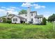 Expansive backyard with patio, grill, and lush green lawn at 9653 Cypress Way, Carmel, IN 46032
