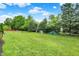 View of a well-maintained lawn with trees and play equipment at 9653 Cypress Way, Carmel, IN 46032