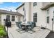 Backyard patio set with nice yard and home exterior at 9653 Cypress Way, Carmel, IN 46032