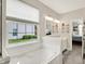 Bathroom offers a garden tub with subway tile backsplash and view to the backyard at 9653 Cypress Way, Carmel, IN 46032