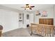 This bedroom features carpet, a wooden bedframe, wall decor, and double door closets at 9653 Cypress Way, Carmel, IN 46032