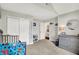 Bedroom featuring carpet, a crib, closet, wall decor, and natural light at 9653 Cypress Way, Carmel, IN 46032