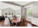 Cozy dining area featuring hardwood floors and natural light from large windows at 9653 Cypress Way, Carmel, IN 46032
