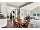 Dining area next to kitchen overlooks the living room and backyard at 9653 Cypress Way, Carmel, IN 46032