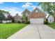 Charming brick home with well-kept lawn, tidy landscaping, and a two car garage at 9653 Cypress Way, Carmel, IN 46032