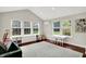 Spacious living room with ample natural light and stylish built-in storage at 9653 Cypress Way, Carmel, IN 46032