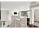 Bright loft with built-in shelves, offering a cozy space, and view of the bedroom at 9653 Cypress Way, Carmel, IN 46032