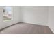 Bright bedroom with a large window providing natural light and neutral carpeting at 10416 Crystal Coop Ln, Indianapolis, IN 46235
