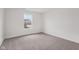 Bedroom featuring neutral carpeting, a bright window, and natural light at 10416 Crystal Coop Ln, Indianapolis, IN 46235