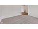 Comfortable bedroom with plush carpeting and a view into the connected bathroom at 10416 Crystal Coop Ln, Indianapolis, IN 46235
