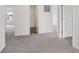 Spacious bedroom with plush carpeting and multiple doorways leading to closets and hallways at 10416 Crystal Coop Ln, Indianapolis, IN 46235