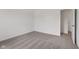 An empty bedroom featuring neutral carpeting and a doorway at 10416 Crystal Coop Ln, Indianapolis, IN 46235