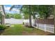 Fenced backyard with a swing, green lawn, and a patio with outdoor seating at 1067 Acadia Ct, Indianapolis, IN 46217