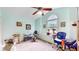 A clean bedroom features carpet, a large window and exercise equipment at 1067 Acadia Ct, Indianapolis, IN 46217