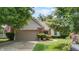 Charming single Gathering home with mature landscaping and a two car attached garage at 1067 Acadia Ct, Indianapolis, IN 46217