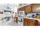 Open kitchen and dining area with wooden cabinets and natural light at 1067 Acadia Ct, Indianapolis, IN 46217