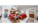 Light filled living room featuring brick fireplace, neutral paint, and light colored flooring at 1067 Acadia Ct, Indianapolis, IN 46217