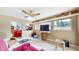 Cozy living room area showcasing bright walls and tons of natural light from the window at 1067 Acadia Ct, Indianapolis, IN 46217