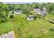 Aerial view showcasing the expansive lot, home, and outbuildings, providing a comprehensive view of the property at 1130 E 105Th St, Carmel, IN 46280
