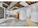 Open basement area with concrete floors, exposed ductwork, and potential for storage or a workshop, offering versatility at 1130 E 105Th St, Carmel, IN 46280