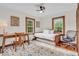 Comfortable bedroom featuring a daybed, desk, and bright windows, perfect for relaxation at 1130 E 105Th St, Carmel, IN 46280