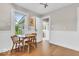 Charming dining area with wainscoting, a classic table and chairs, and natural light at 1130 E 105Th St, Carmel, IN 46280