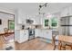 Bright kitchen featuring granite countertops, stainless steel appliances, and a breakfast nook at 1130 E 105Th St, Carmel, IN 46280