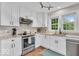 Well-lit kitchen featuring granite counters, stainless steel appliances, and ample storage at 1130 E 105Th St, Carmel, IN 46280