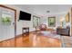 Inviting living room with hardwood floors, large windows, and traditional furnishings at 1130 E 105Th St, Carmel, IN 46280