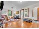 Cozy living room with hardwood floors, classic furniture, and plenty of natural light at 1130 E 105Th St, Carmel, IN 46280