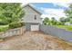 View of the back of the house showing the walkout basement and detached garage at 1130 E 105Th St, Carmel, IN 46280