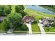 Aerial view of brick home near pond, golf course, and other homes, in a lovely neighborhood at 1326 Pebble Brook Dr, Noblesville, IN 46062
