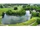 Lush golf course community with a scenic pond and luxurious homes, offering a tranquil living environment at 1326 Pebble Brook Dr, Noblesville, IN 46062