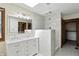 Remodeled bathroom with tiled walk-in shower, skylight, and large double sink vanity at 1326 Pebble Brook Dr, Noblesville, IN 46062