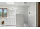 Bright bathroom with skylight features walk-in shower and double sink vanity at 1326 Pebble Brook Dr, Noblesville, IN 46062