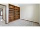 Bedroom with built-in bookshelves and neutral carpet at 1326 Pebble Brook Dr, Noblesville, IN 46062