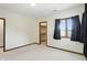 Spacious bedroom with a window, neutral carpet and a view to closet at 1326 Pebble Brook Dr, Noblesville, IN 46062